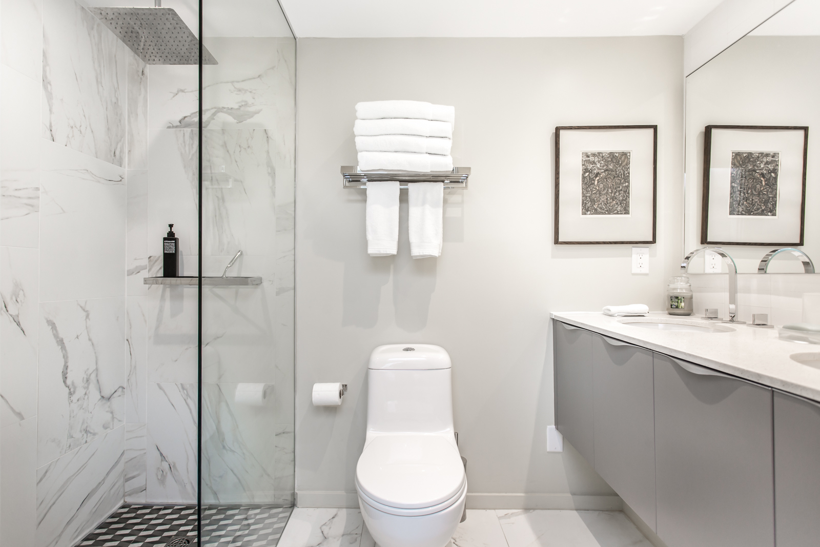 Photo of bathroom and it looks so beautiful with gray colours and simple layout.