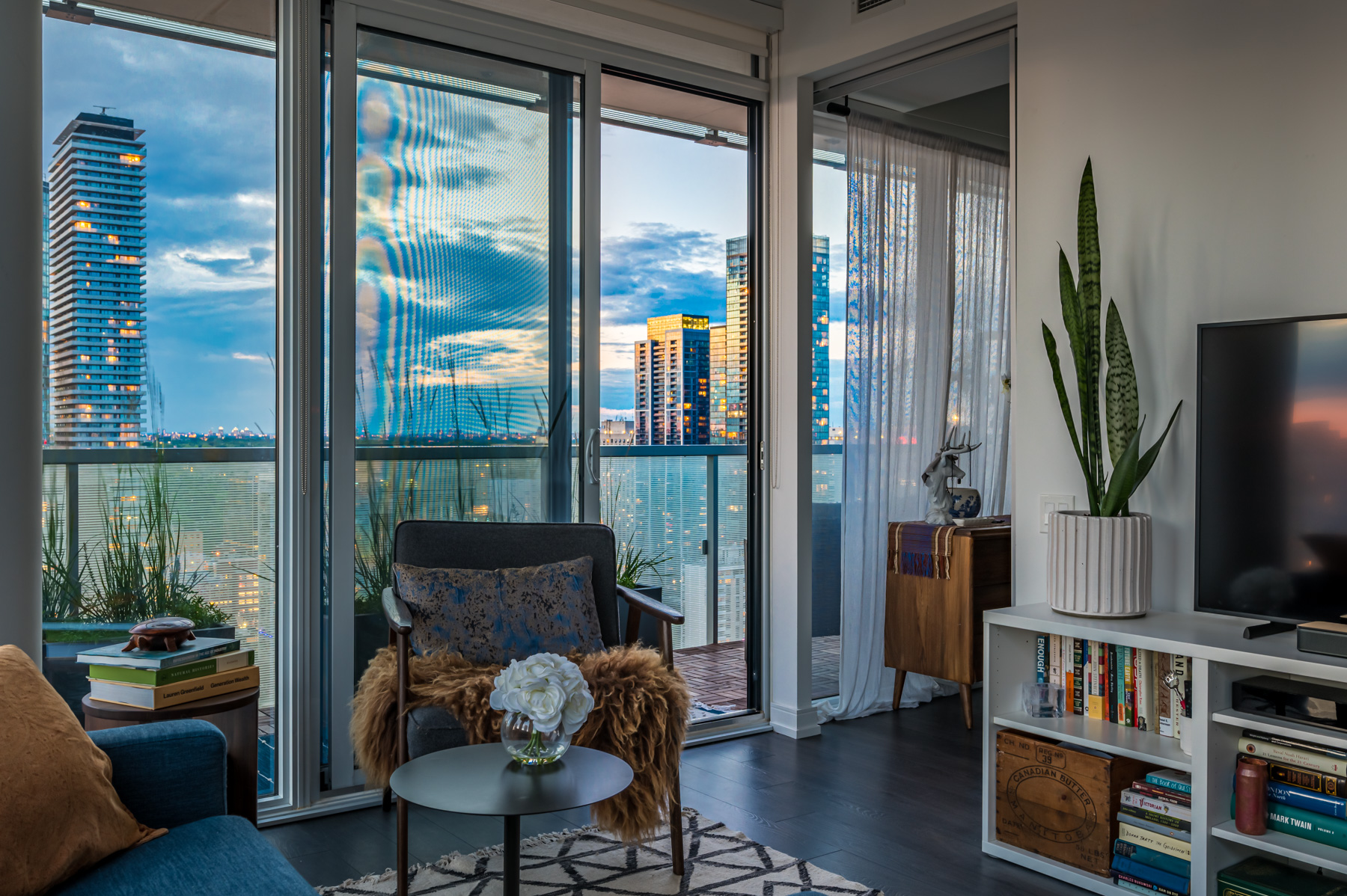 View of 28 Wellesley St Unit 3009 living room during evening.