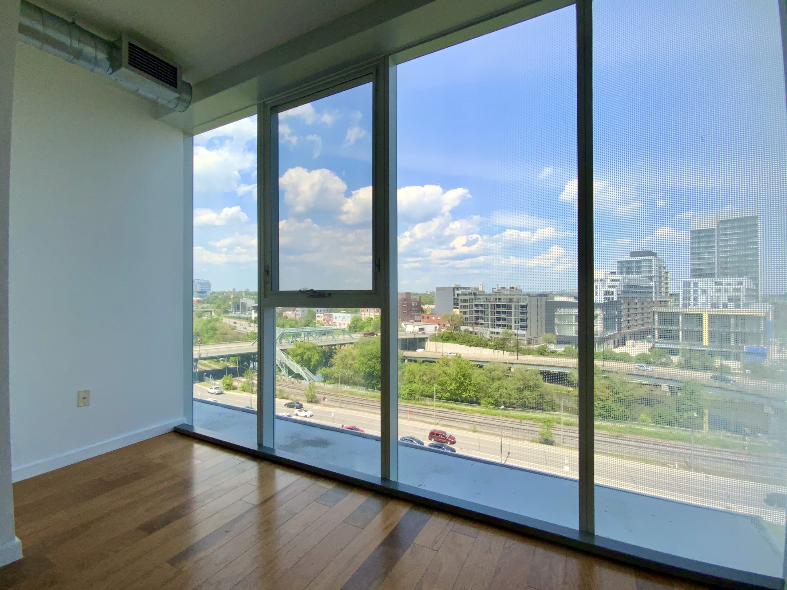 Condo living room with large windows.