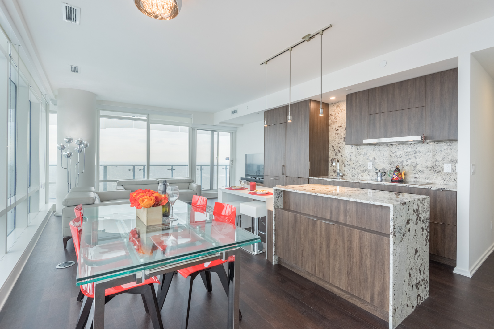 This image shows the condo's open concept design, including the kitchen and living room