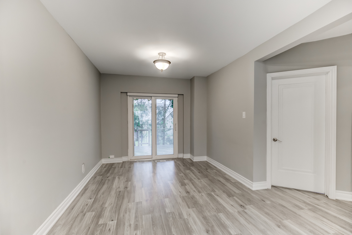 Dining room with view of backyard and deck.