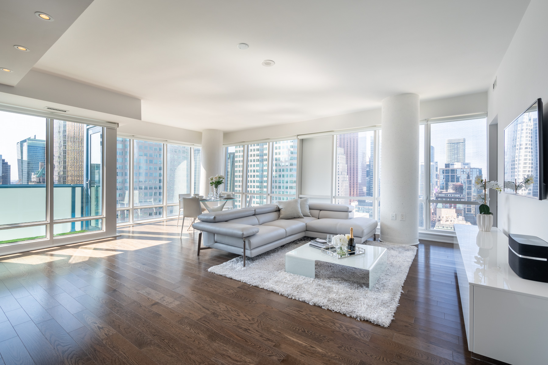 Condo with huge windows and hardwood floors.