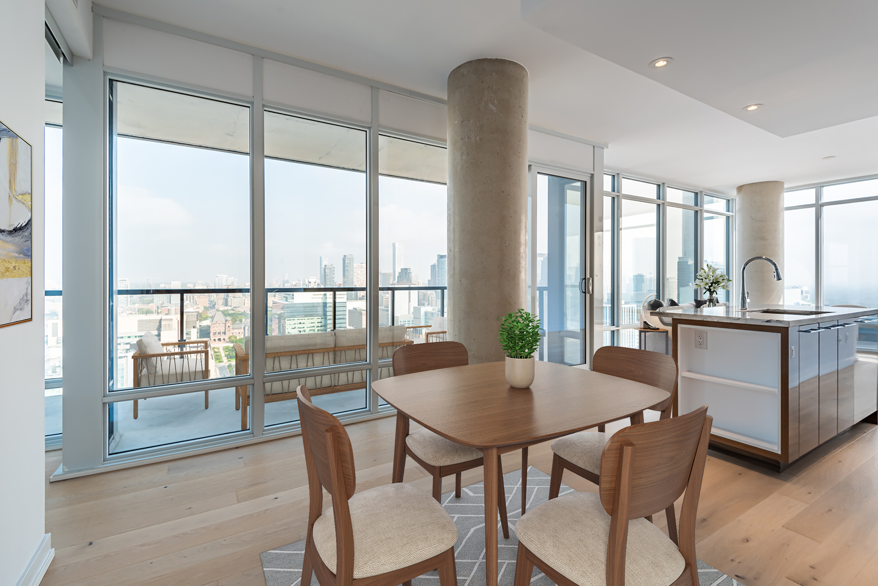 Condo dining room with table, chairs and view of Toronto.