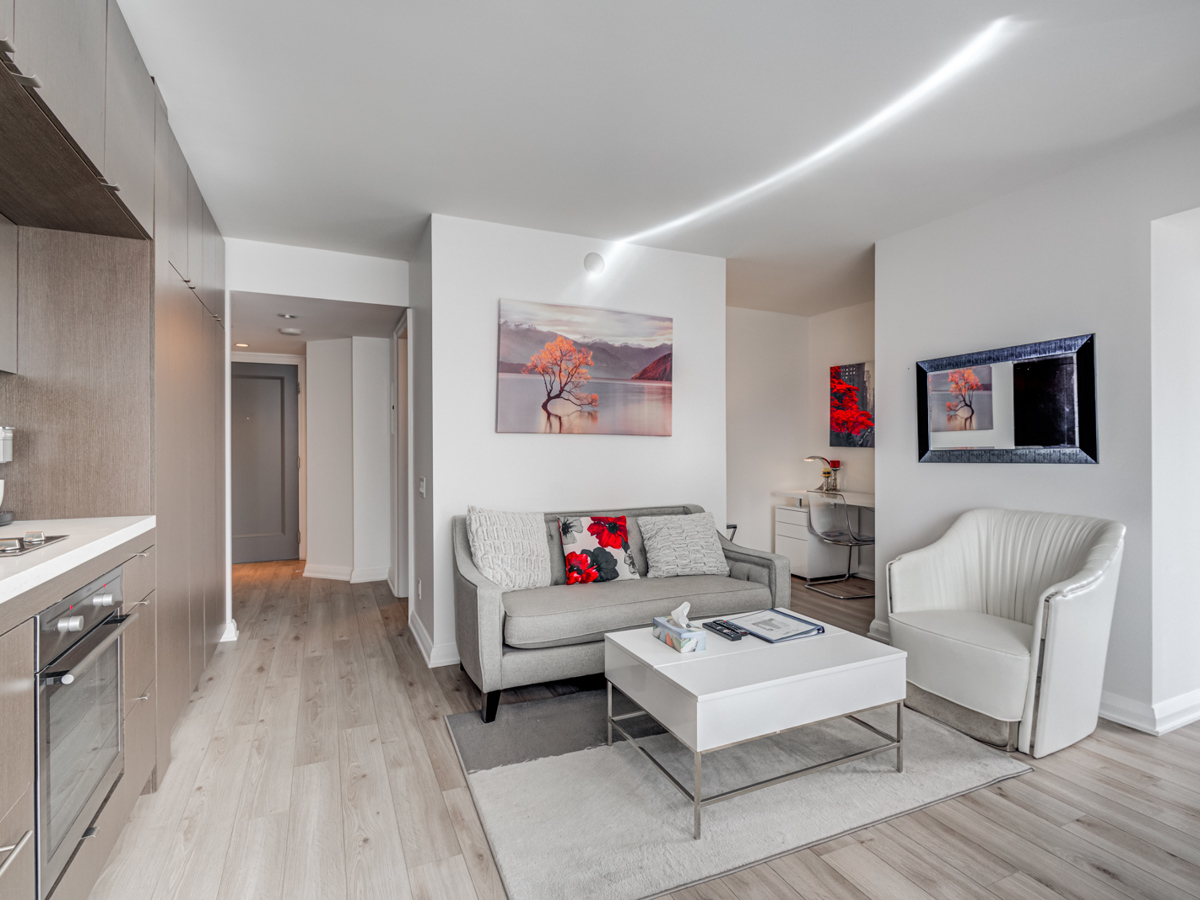 Gorgeous open-concept living room and kitchen of 155 Yorkville Unit 1614.
