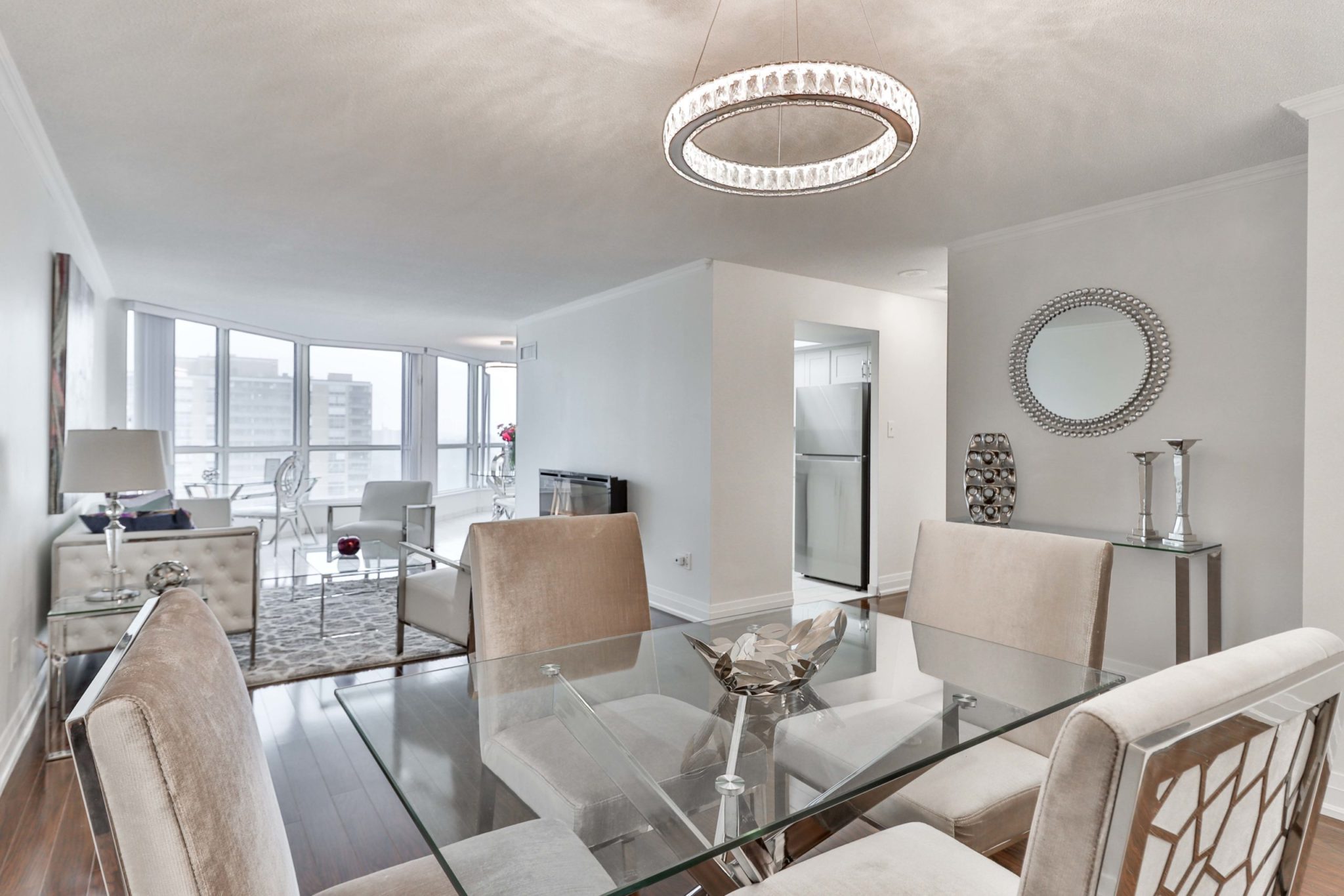 Open-concept dining room and living room with modern furniture.