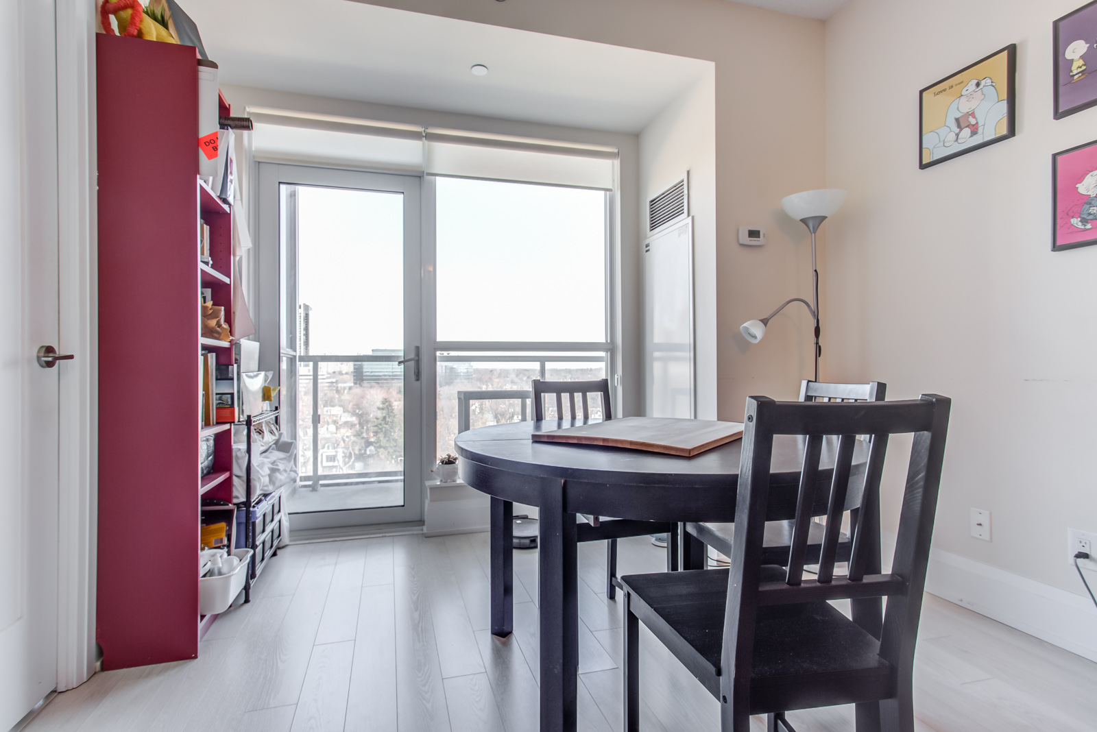 Dining room and table in front of balcony at 120 Harrison Garden Unit 1025.