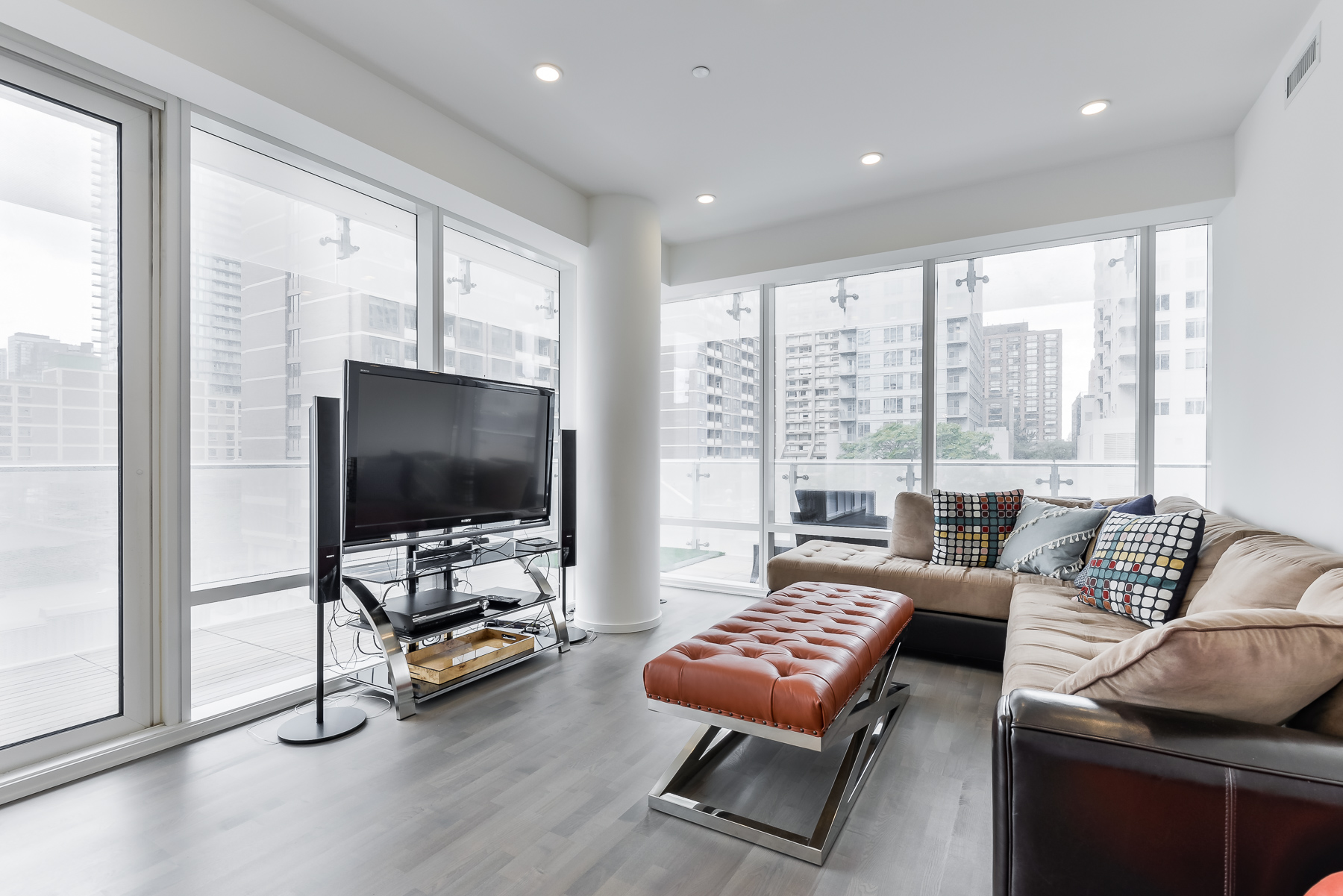 Another shot of living room and furniture of 1 Bloor St E Unit 310 Toronto.