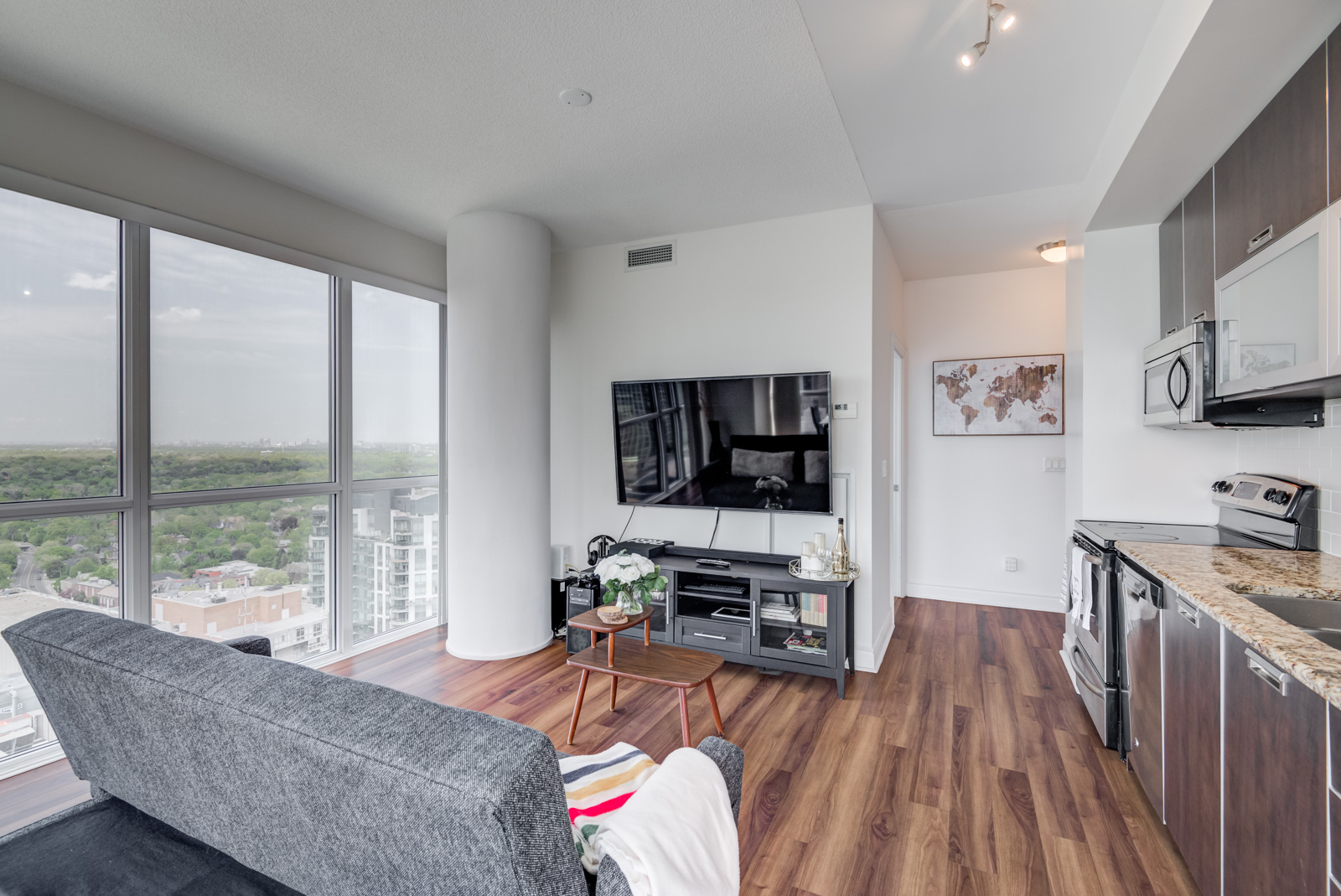 Dark engineered hardwood floors of 28 Ted Rogers Way Unit 3609.