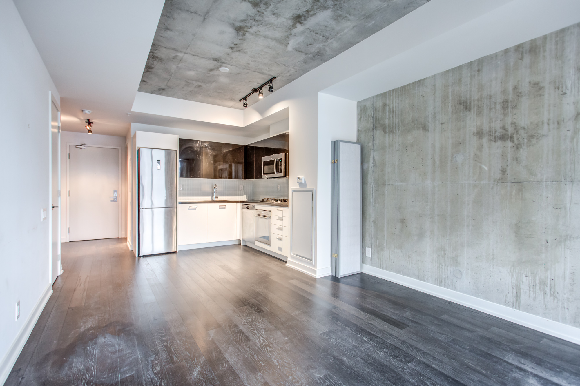 Spacious and empty condo unit at 39 Brant St Unit 918, Brant Park Lofts, in Queen West Toronto.