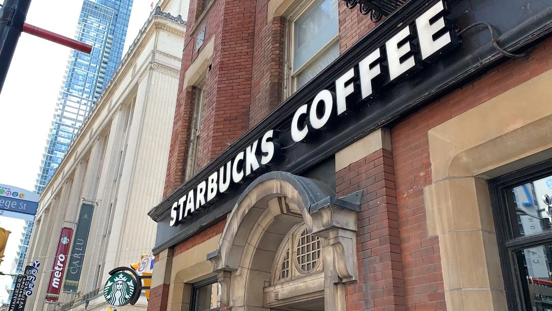 Starbucks sign over store in Yonge and Dundas Toronto.