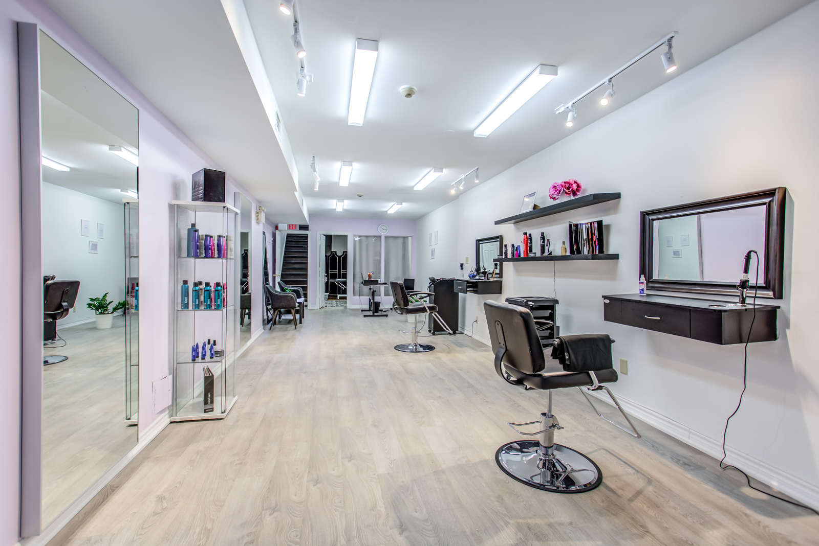 642 queen street west interior; hair salon with styling chairs and other items.
