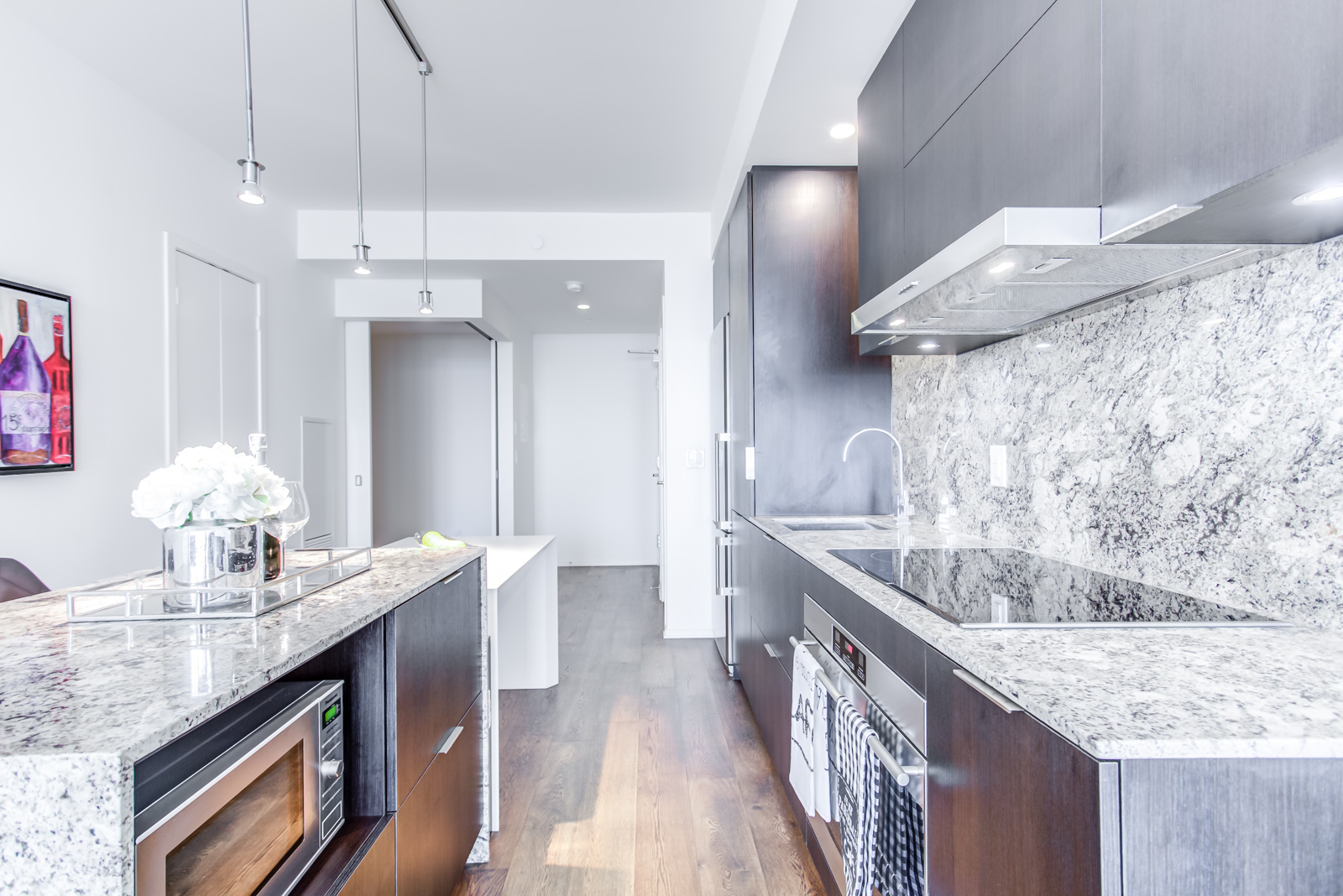 Granite island and kitchen from another angle - 1 Bloor St E Unit 3408.