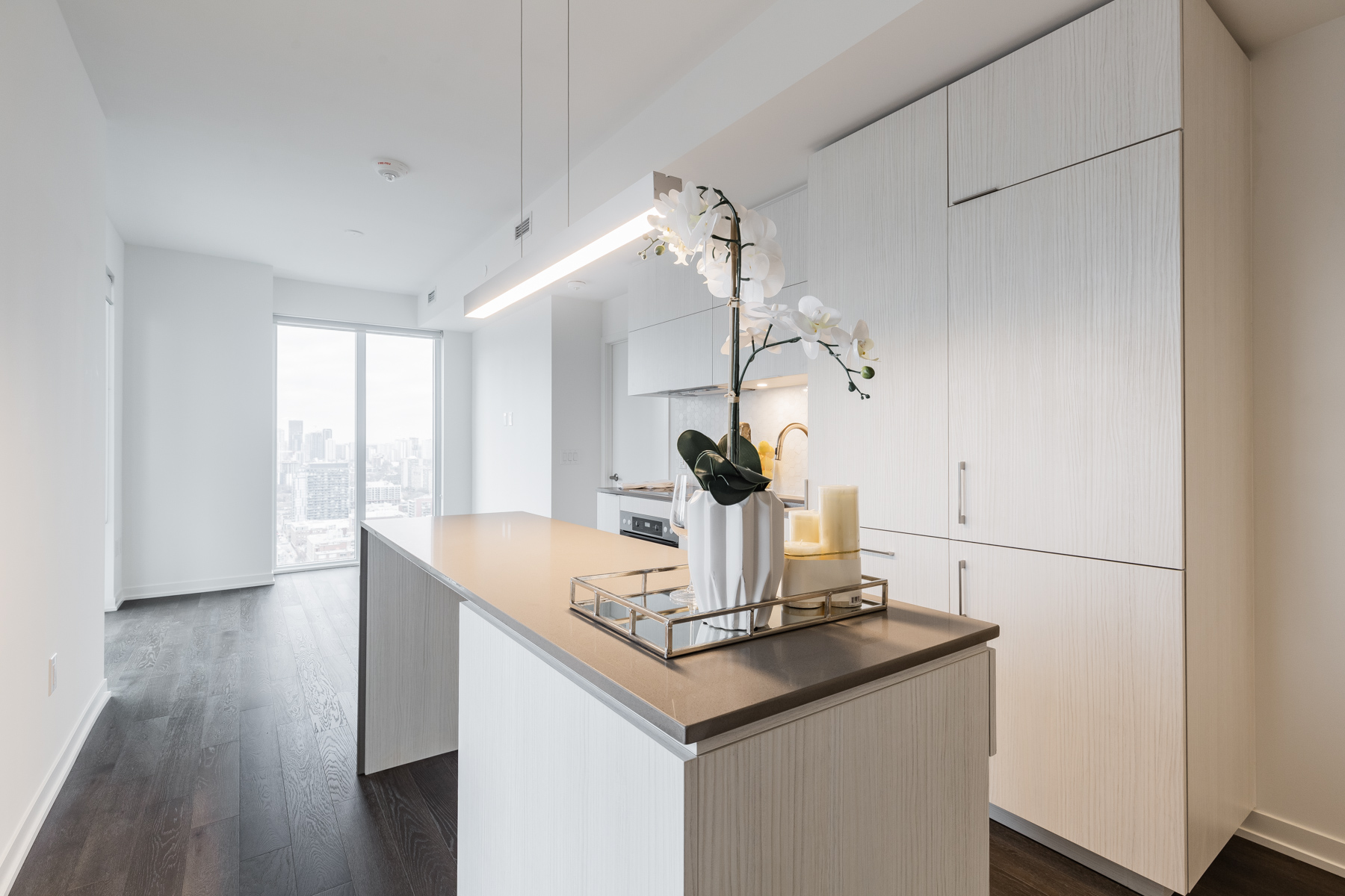 Large kitchen cabinets with soft-close doors and wooden textures.