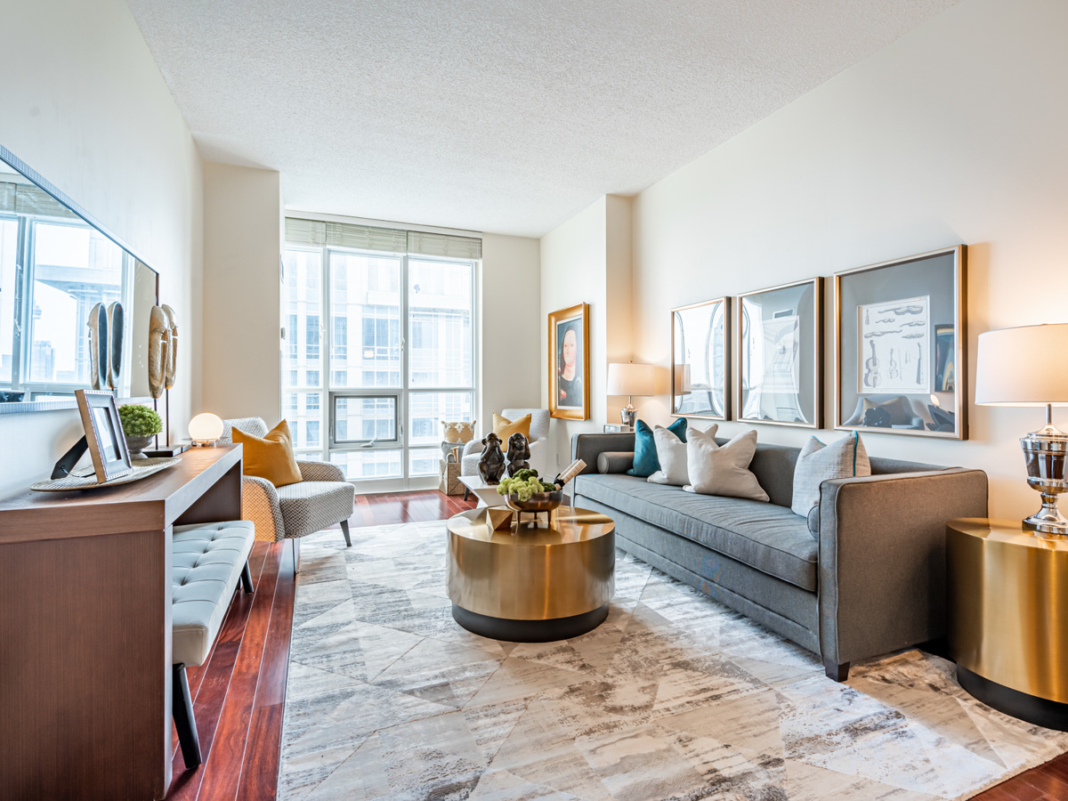 Beautifully decorated condo living room with gray walls.