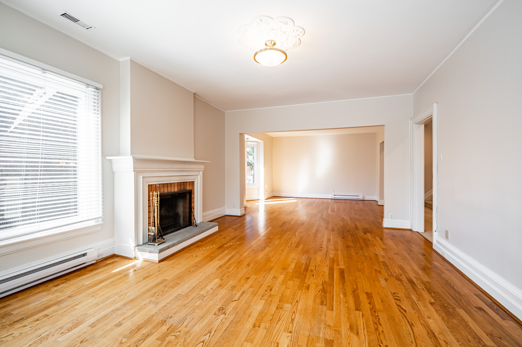 Brick fireplace with white mantle.