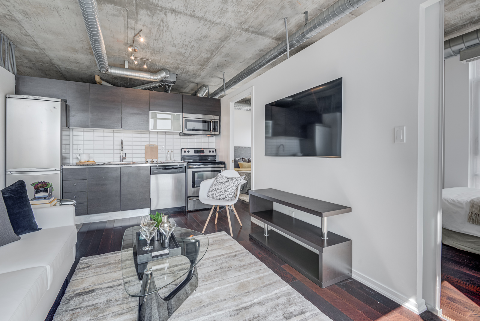 Full view of 150 Sudbury St Suite 511's linear kitchen from living room.