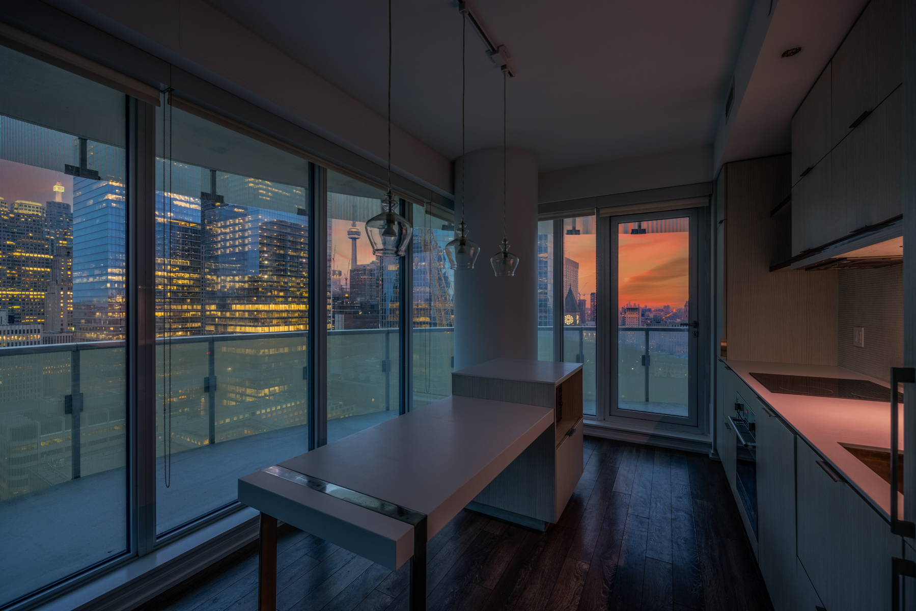 View of Toronto at evening from kitchen windows of 197 Yonge St Unit 2209.