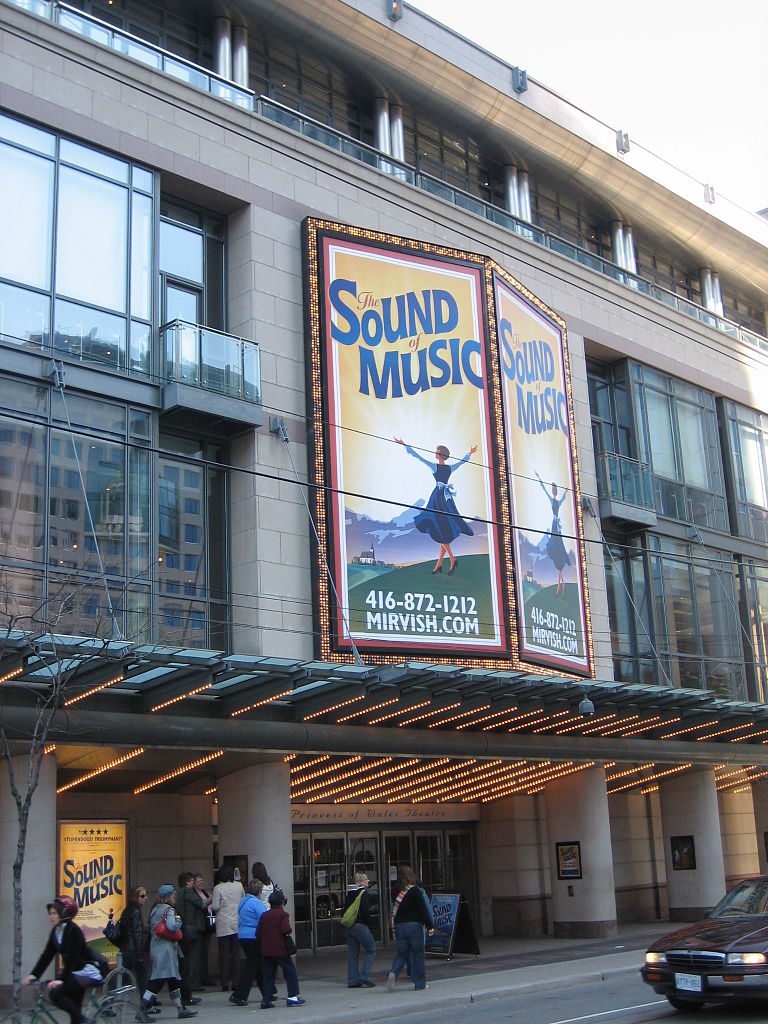 Photo shows The Princess of Wales Theatre and Sound of Music Poster