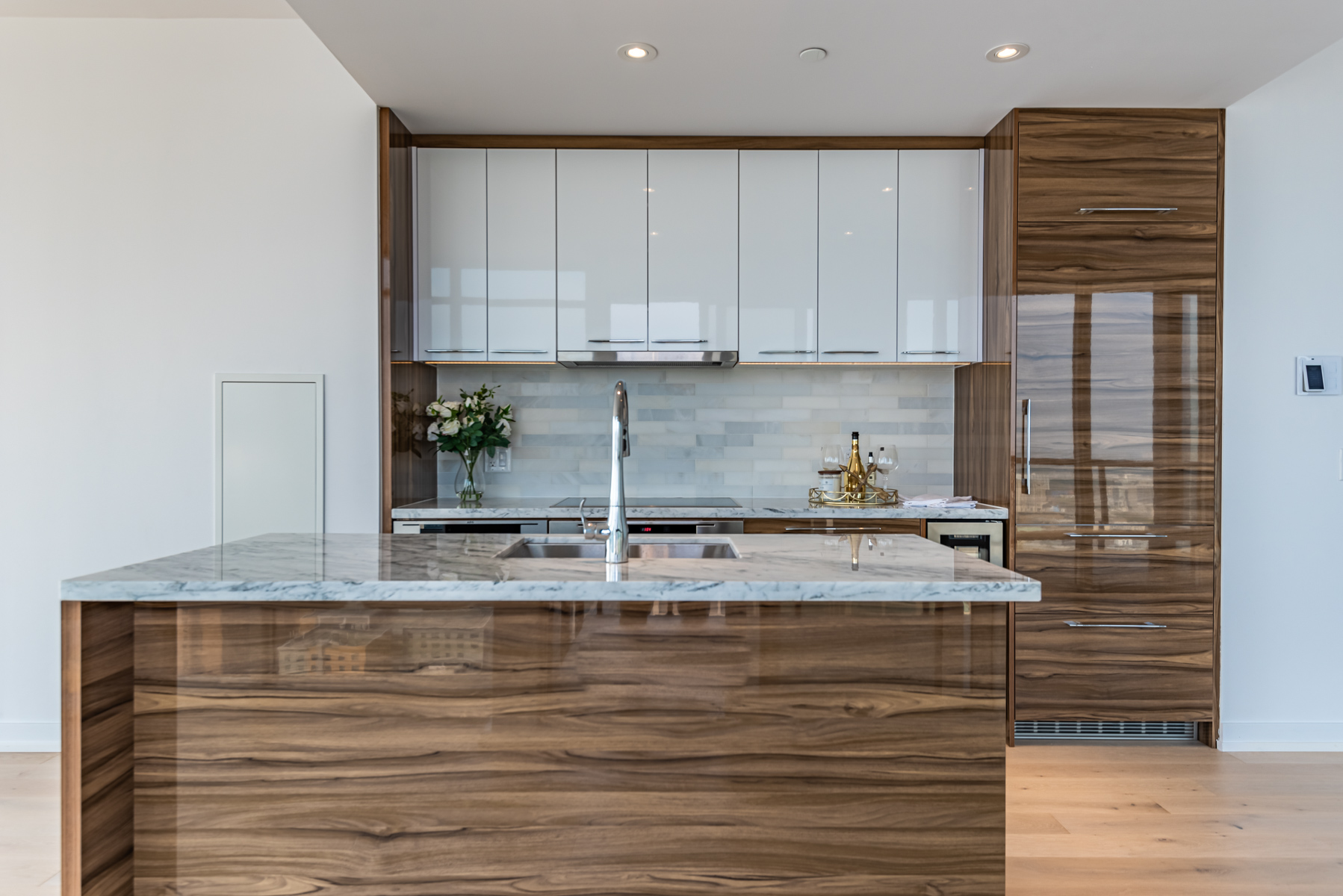 488 University Ave kitchen with gleaming cabinets, drawers and kitchen island.