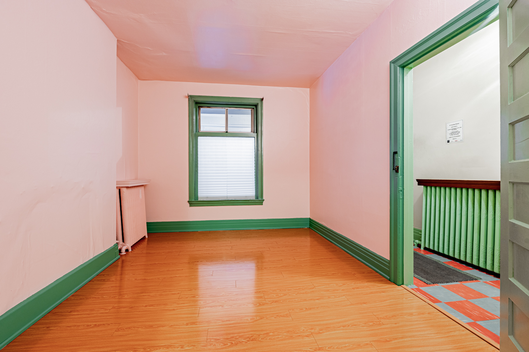 27 Granby St – living room with sleek laminate floors.