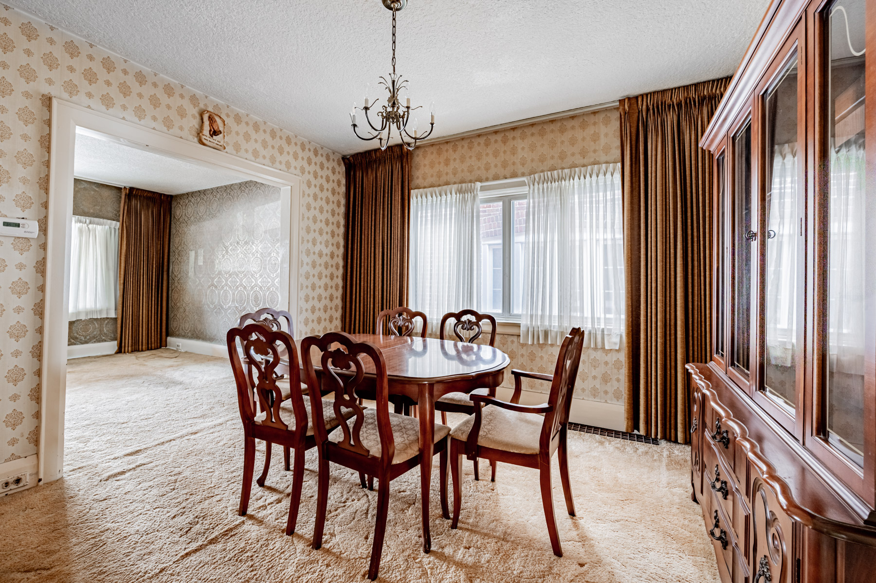 35 Woburn Ave dining room with large window and chandelier.