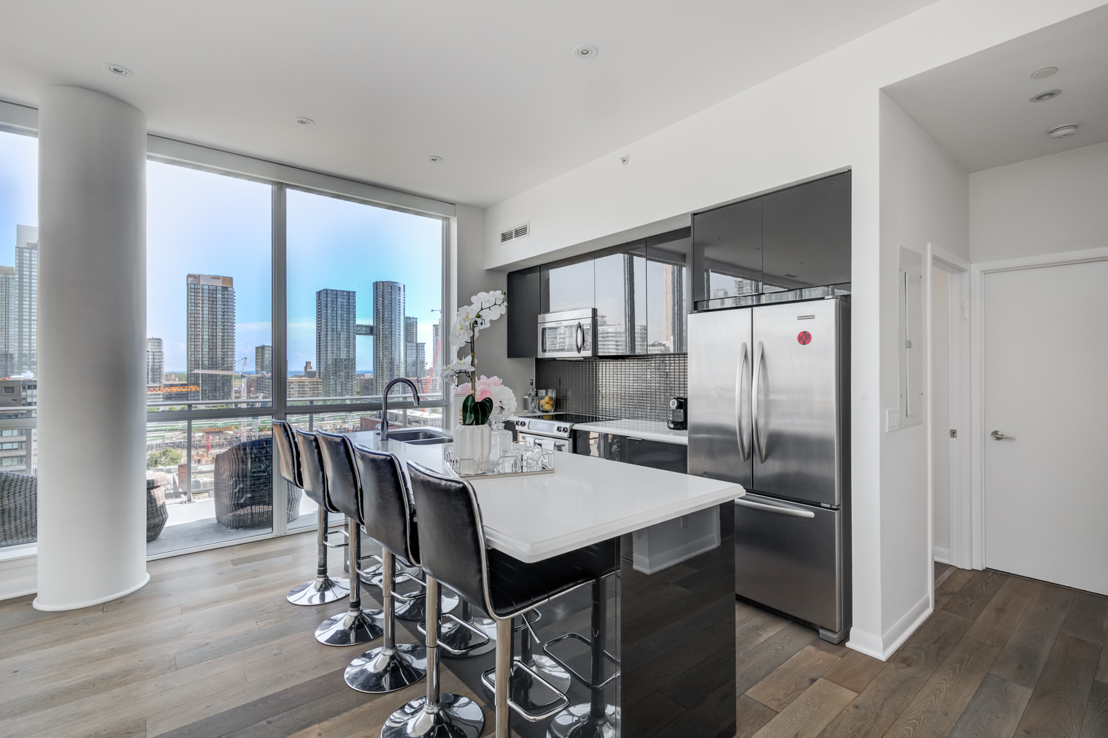 Breakfast bar and kitchen island with stools - Victory Lofts Penthouse Suite in 478 King St W Toronto.