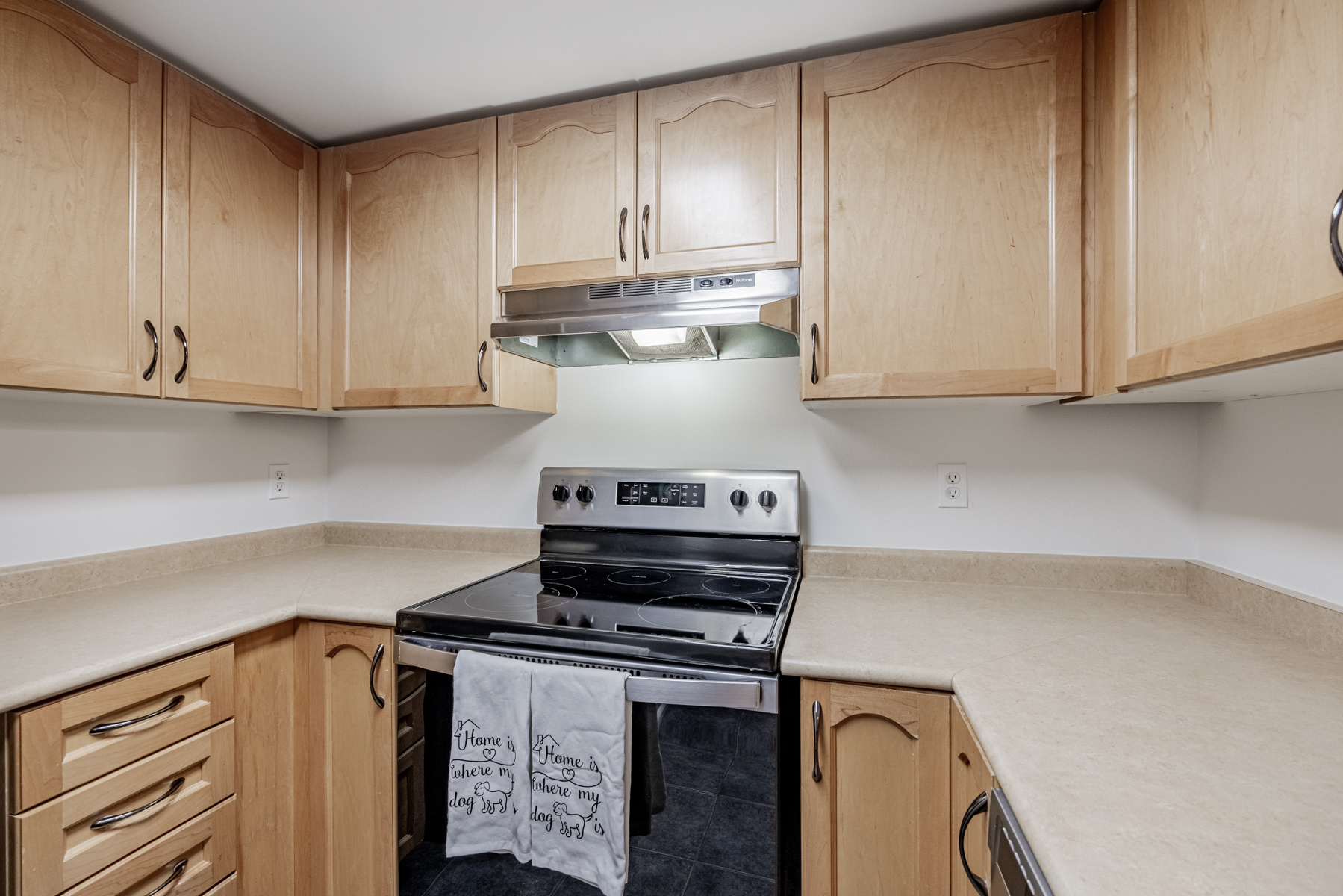 Kitchen with wooden cabinets.