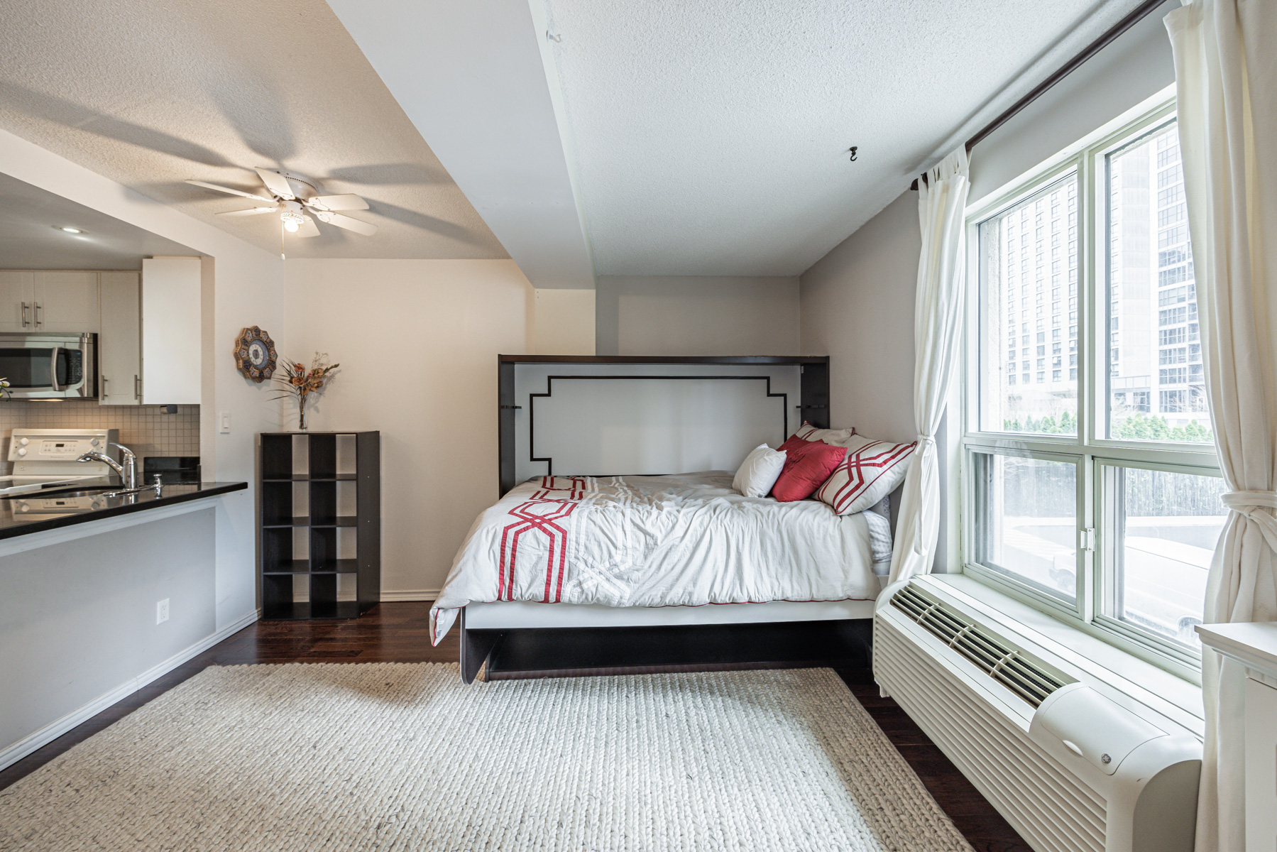 Large condo windows lighting up living room.