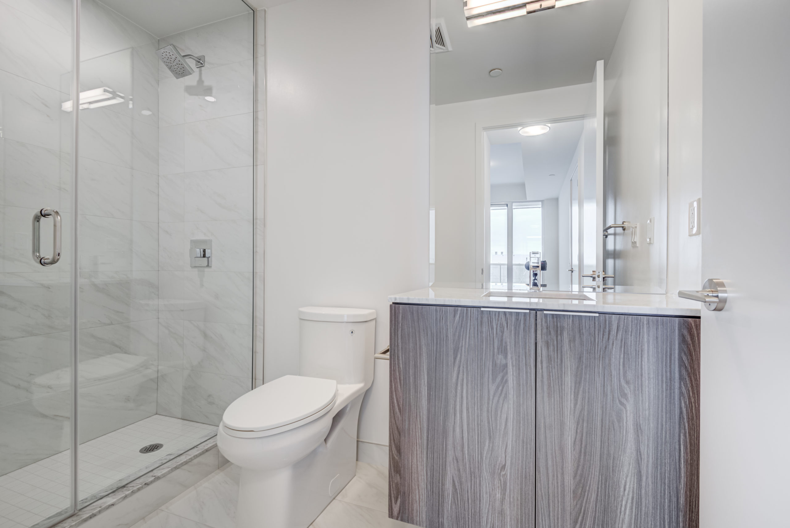 15 Queens Quay E Suite 1901 ensuite bath with gray colour scheme.