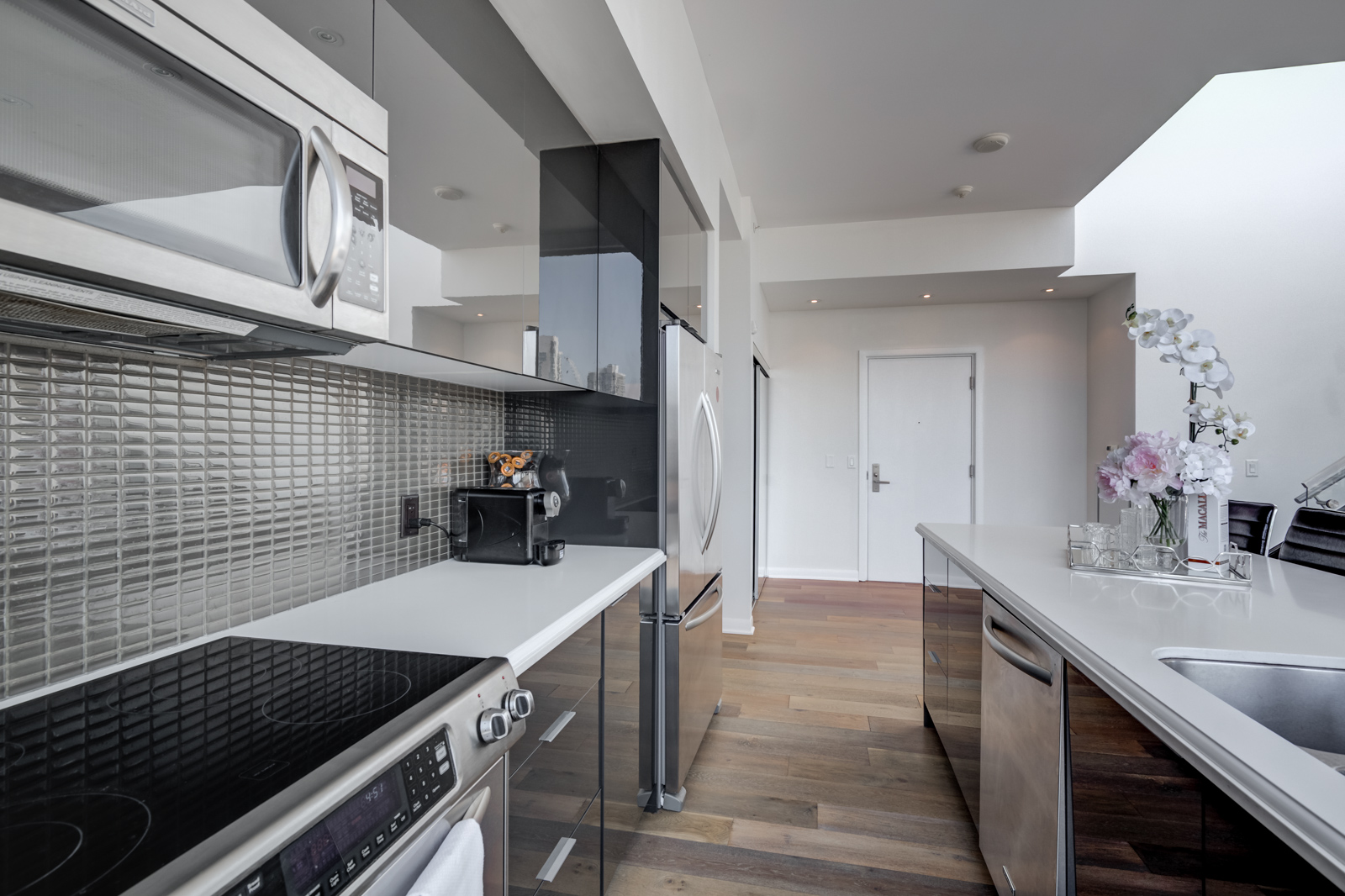 Kitchen appliances, counters and cabinets close up.