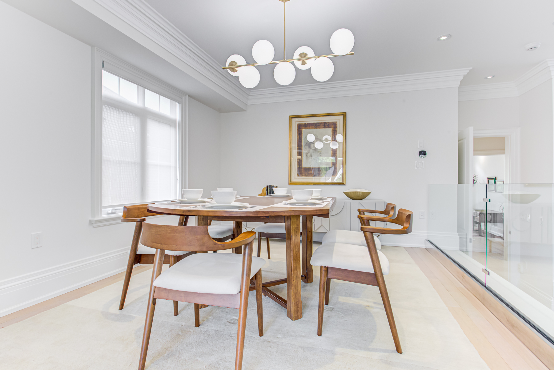 741 Glencairn Ave dining room with chandelier and seating for 10 people.