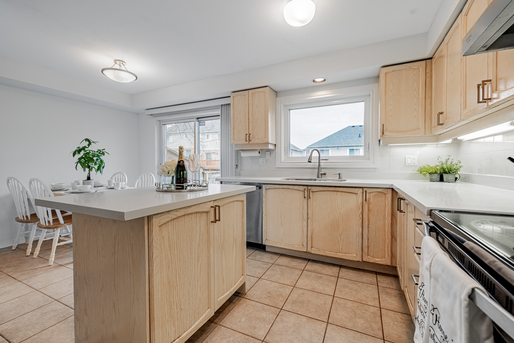 Kitchen island with wooden base, granite top and cabinets.