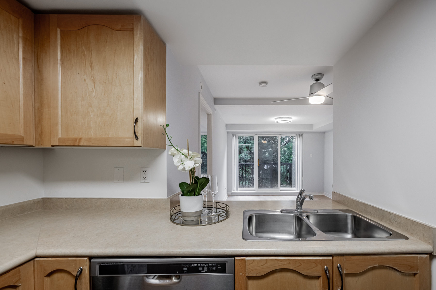 View of 95 George Appleton Way Unit 2162 dining room, living room and balcony from kitchen.