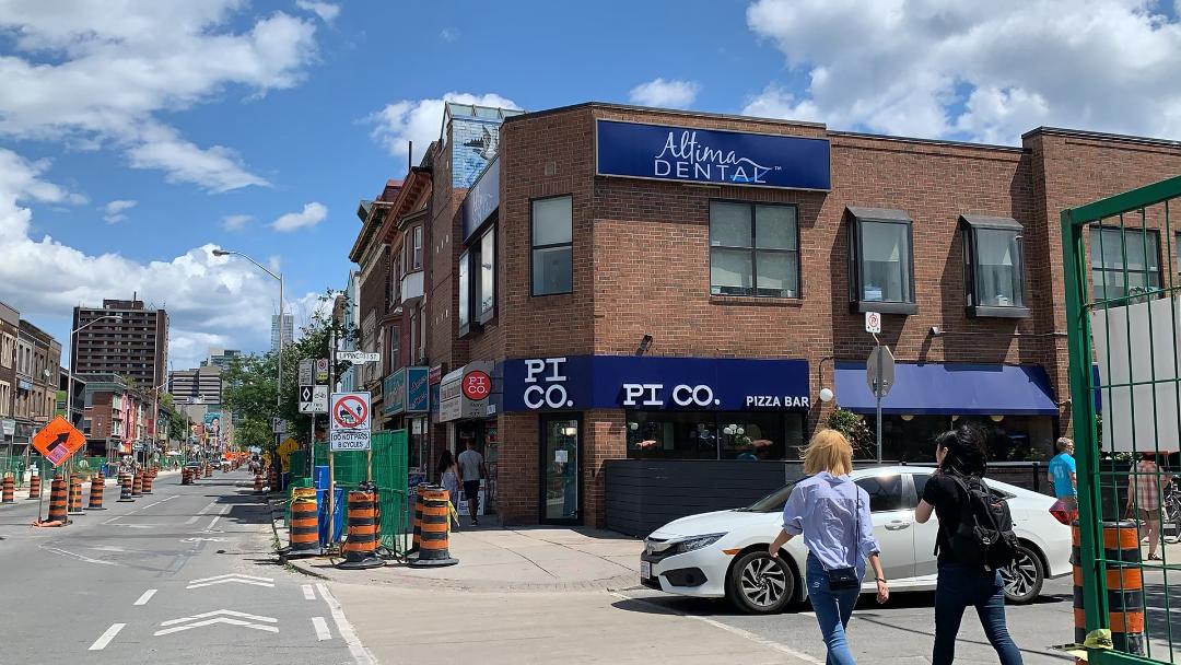 Blue and white PI CO Pizza Bar restaurant on Bathurst and Bloor West in Toronto's The Annex neighbourhood.