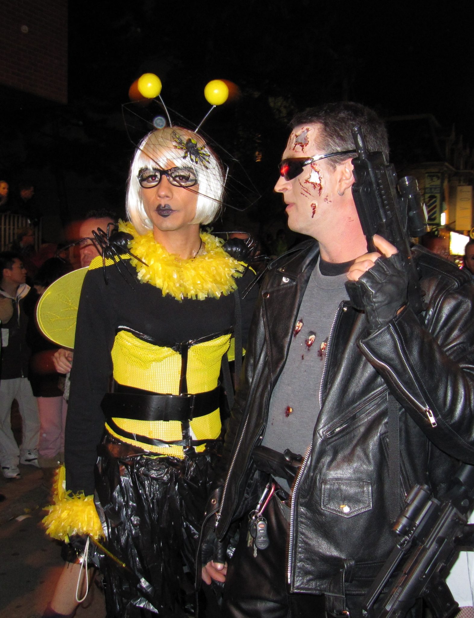 Photo of 2 people dressed as a bee and Terminator. 