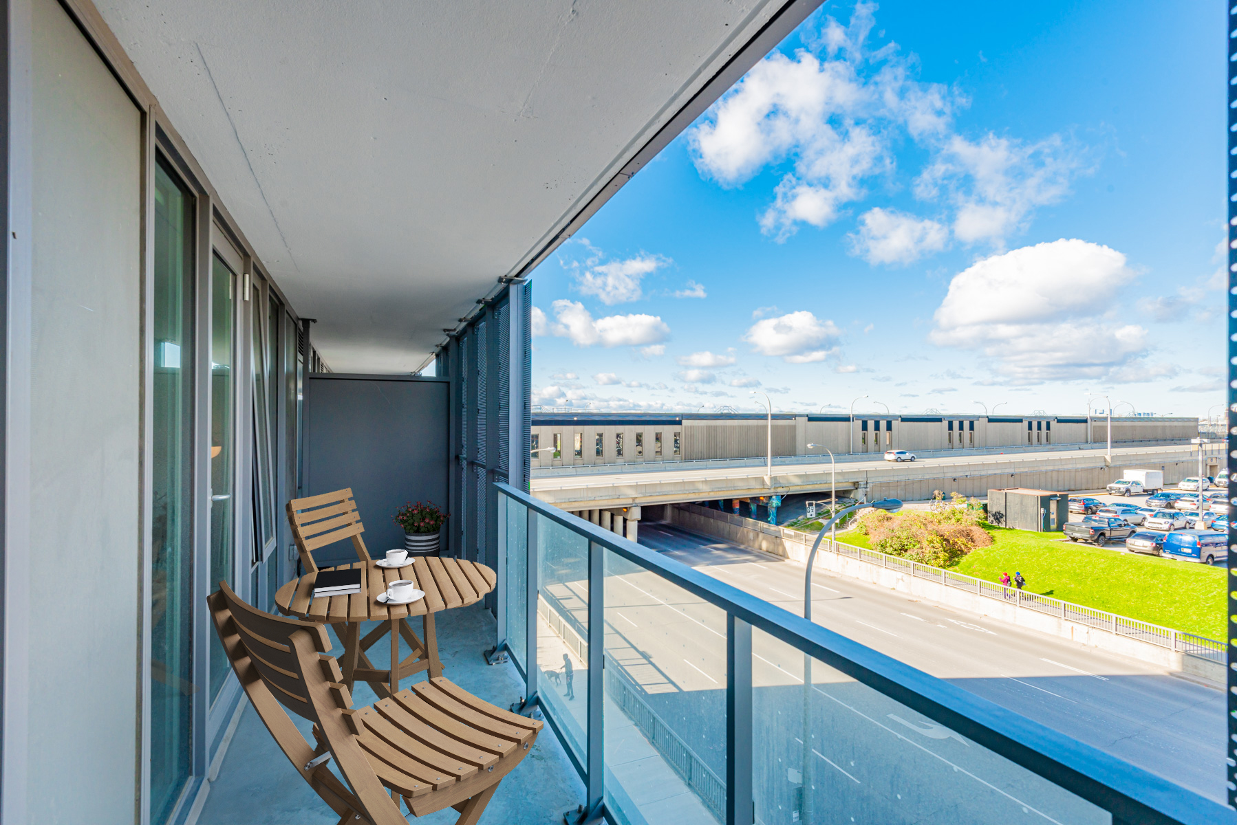 Long condo balcony with patio table and chairs – 38 Monte Kwinter Court Unit 423.