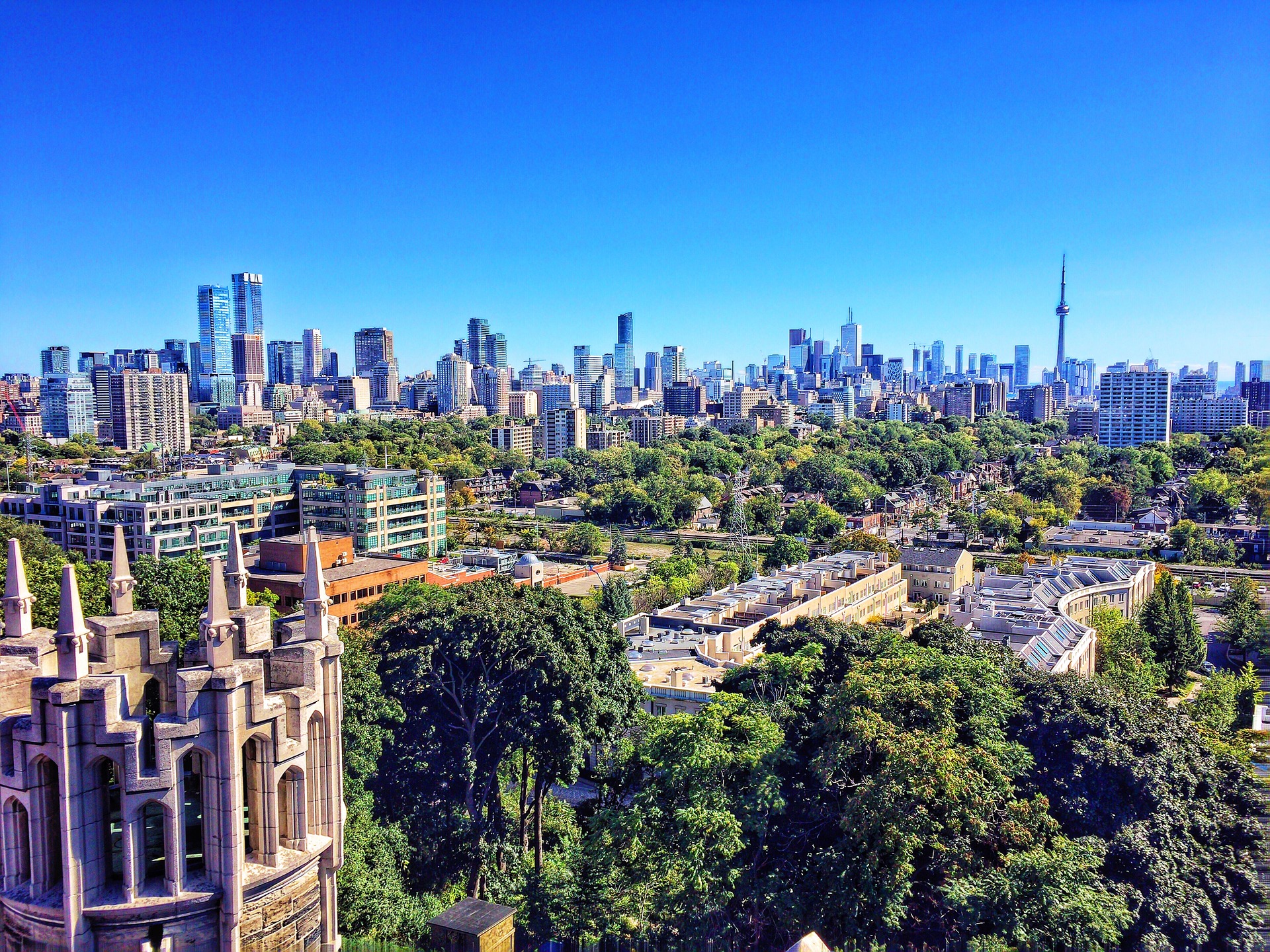 Photo of Toronto skyline from far away, showing CN Tower and Wins Lai Best Toronto Real Estate Agents.