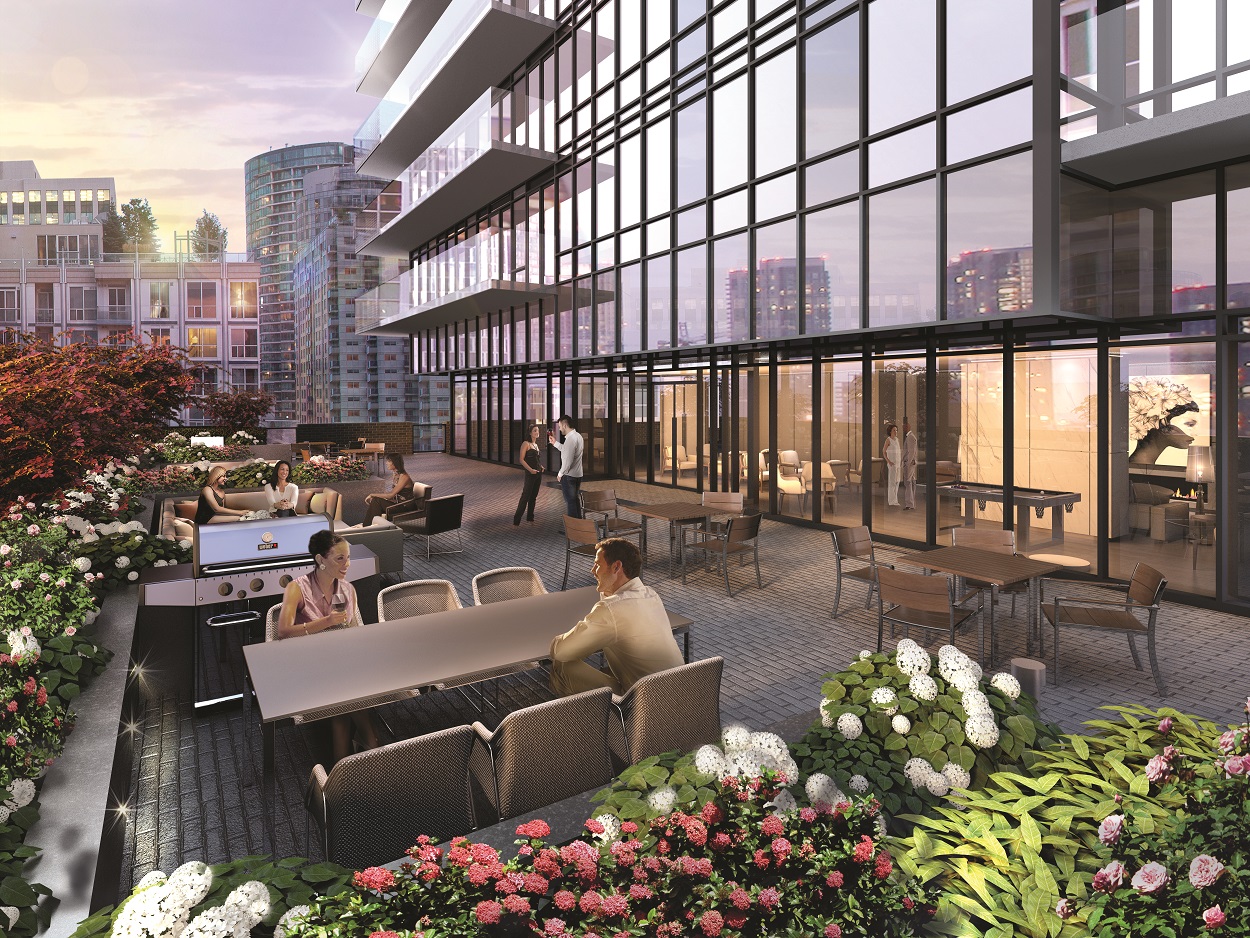 Rooftop deck with people and flowers.