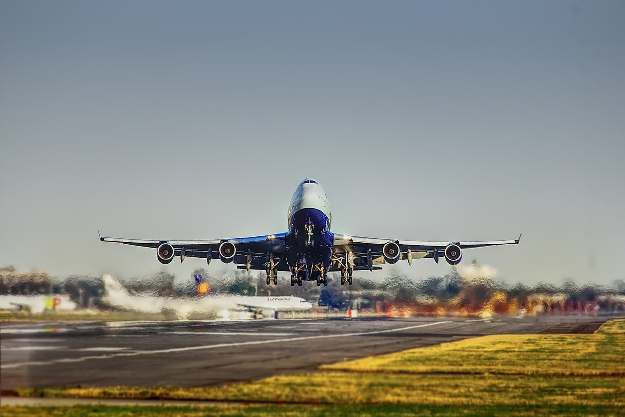 Airplane taking off from tarmac.