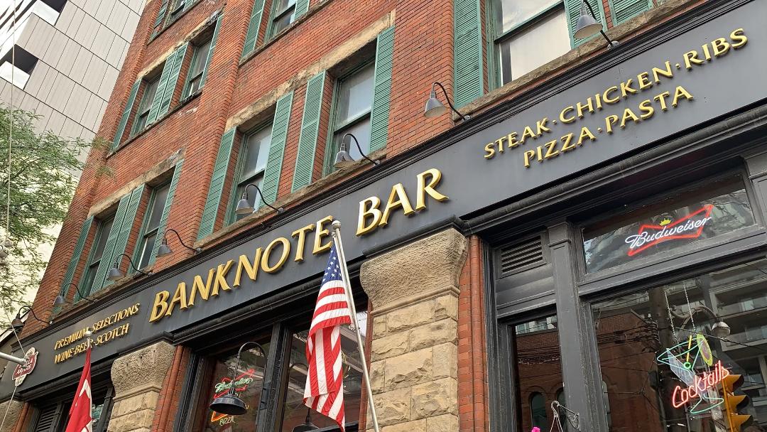 banknote bar gold black sign american flag king st w toronto