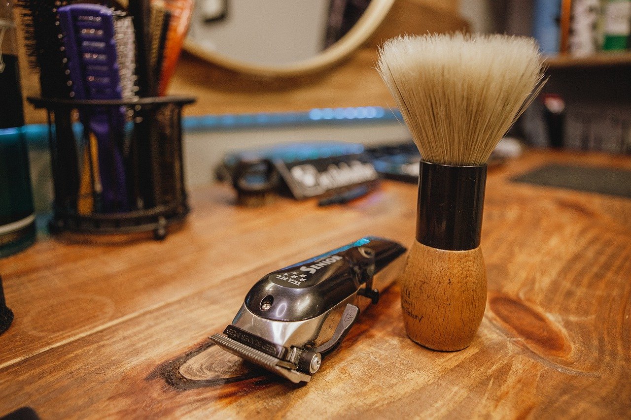 Close up of electric razor and brush in King West barbershop.