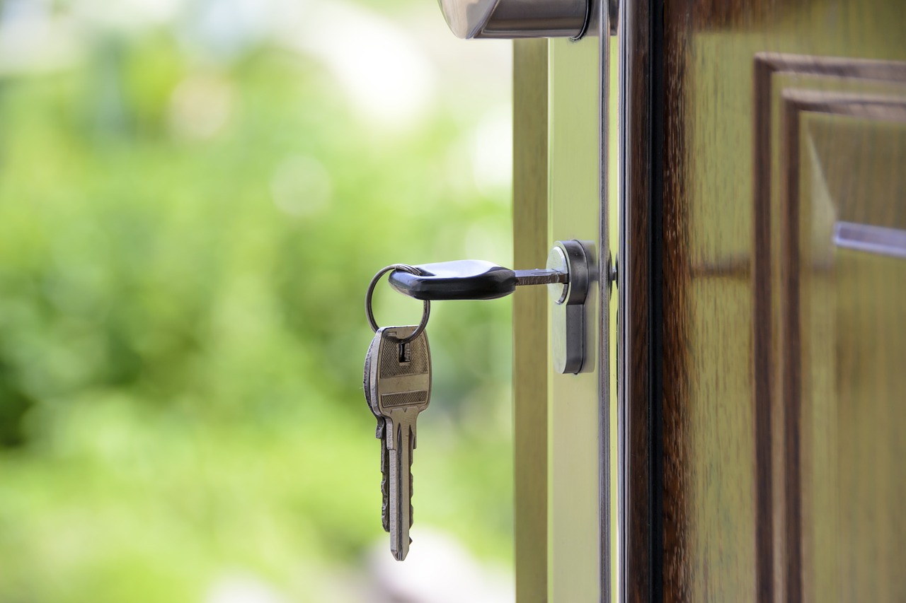 Close up of keys in door lock, representing impact of pot legalization on Toronto real estate.