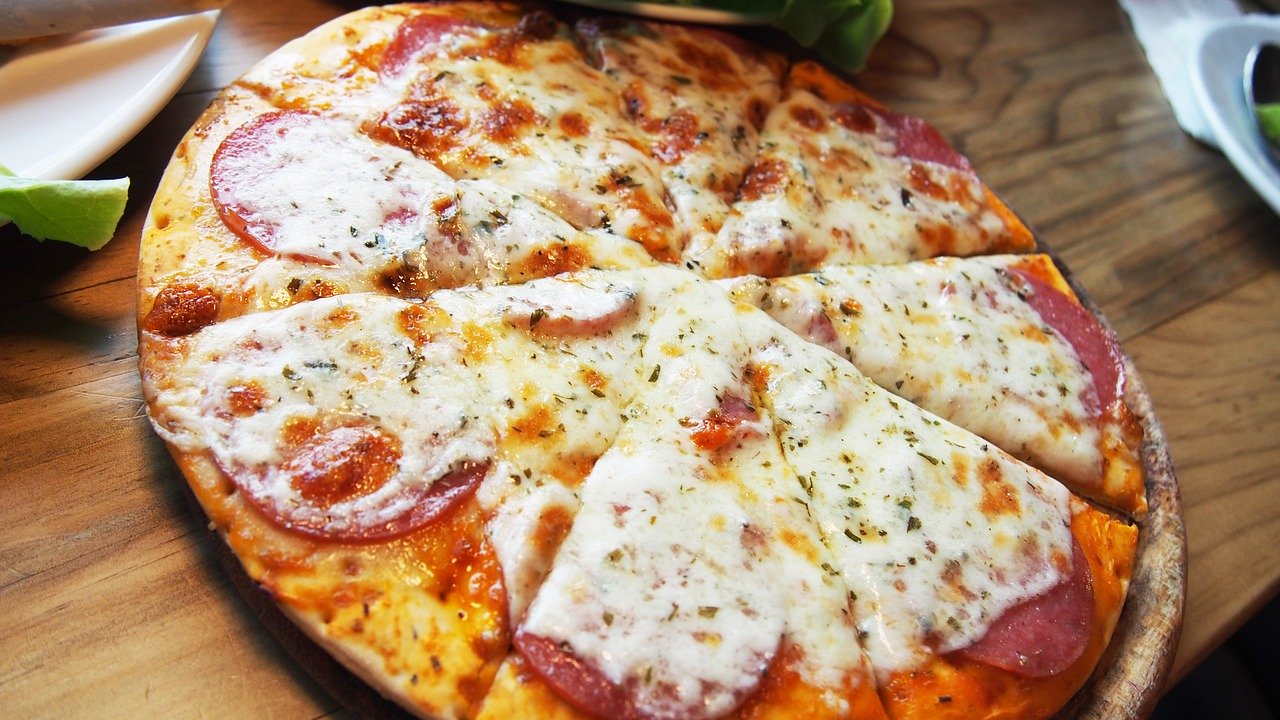 Close up of pizza with white Italian cheese and pepperoni.