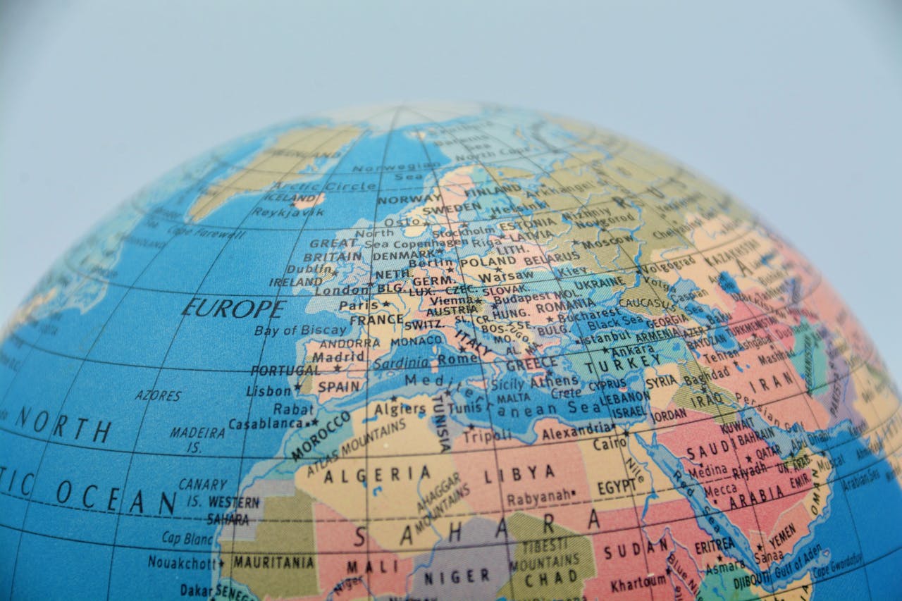 Close up of the top half of a globe showing Europe and Africa.