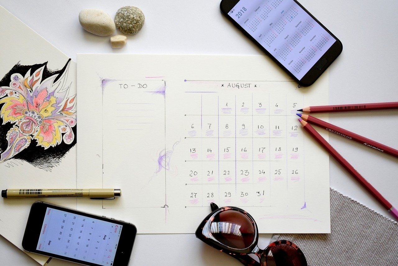 Desk with calendar showing August 2020 housing market vs 2019.