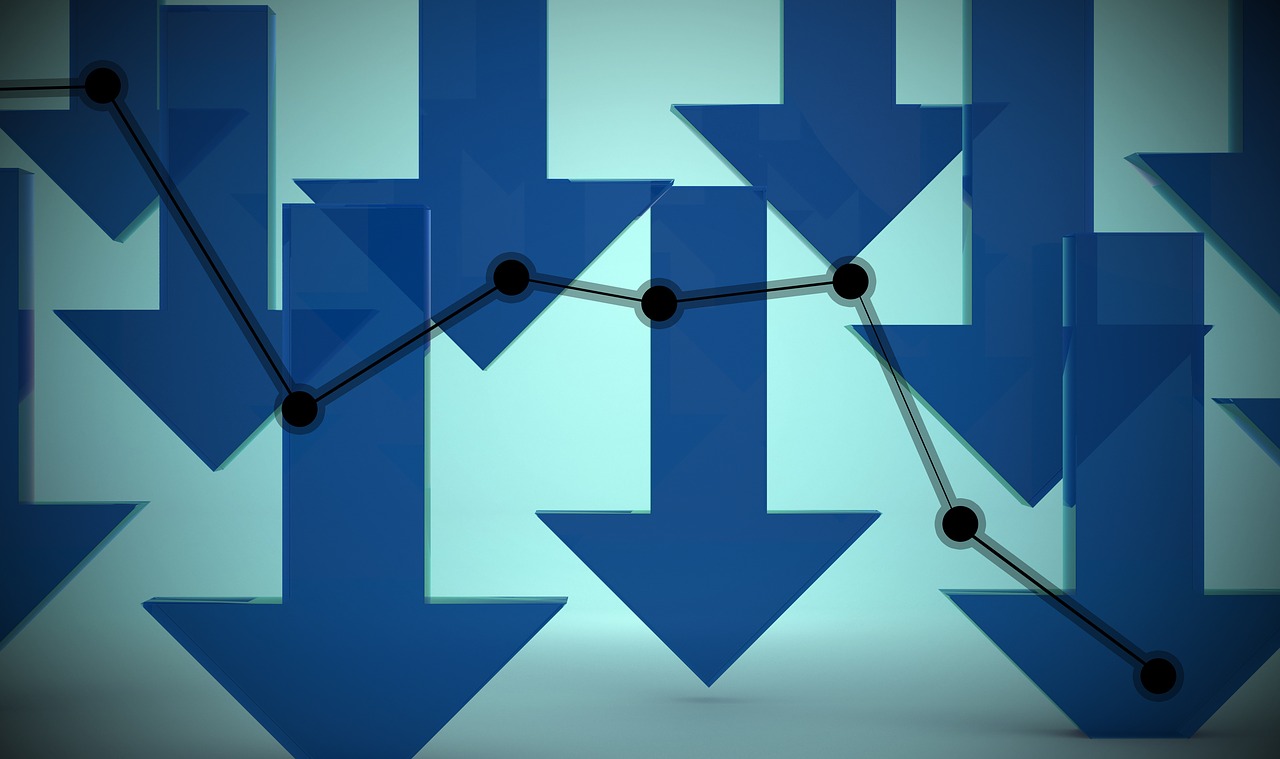 Downward blue arrows showing falling sales in January 2023 GTA housing market.