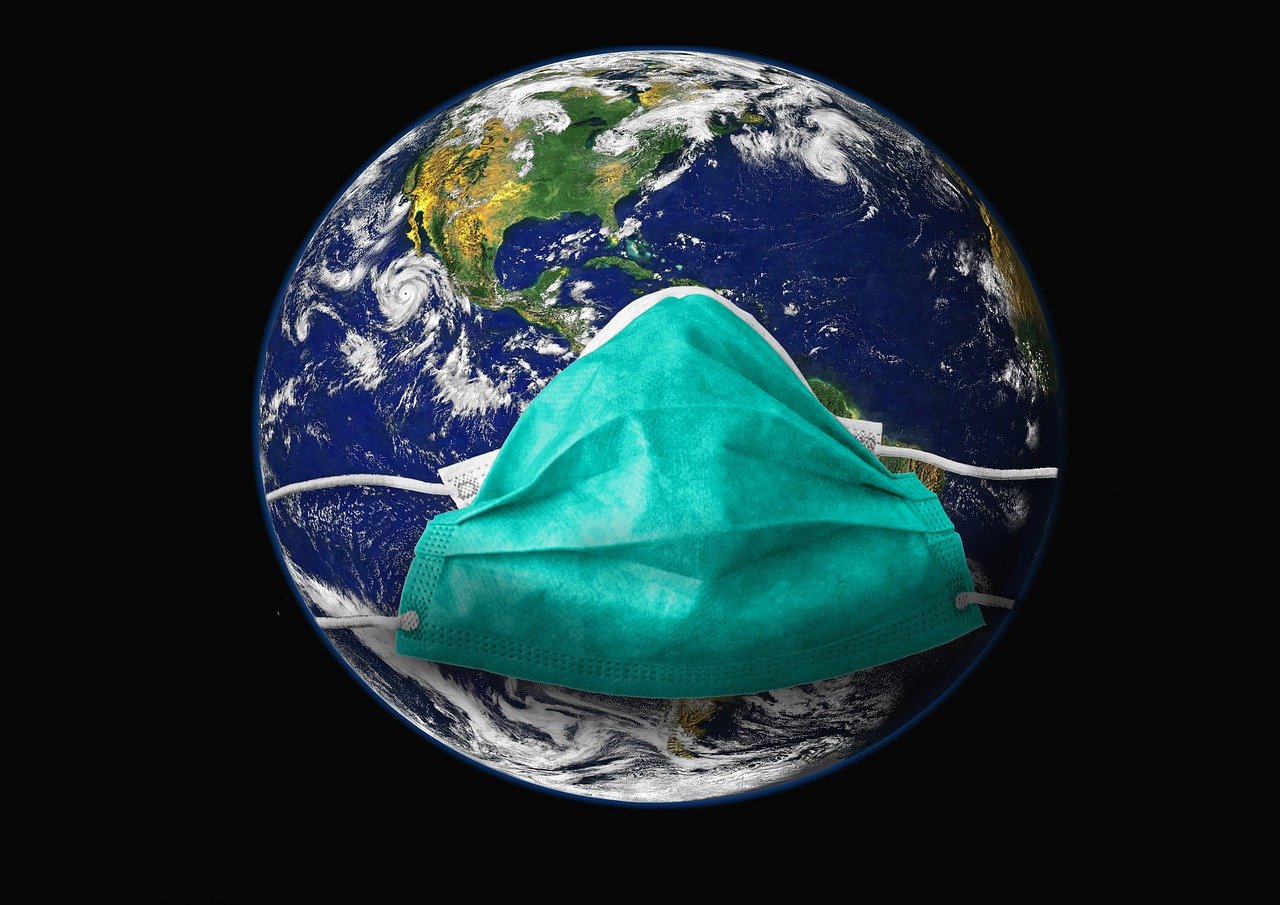 Image of planet Earth in space with medical mask.