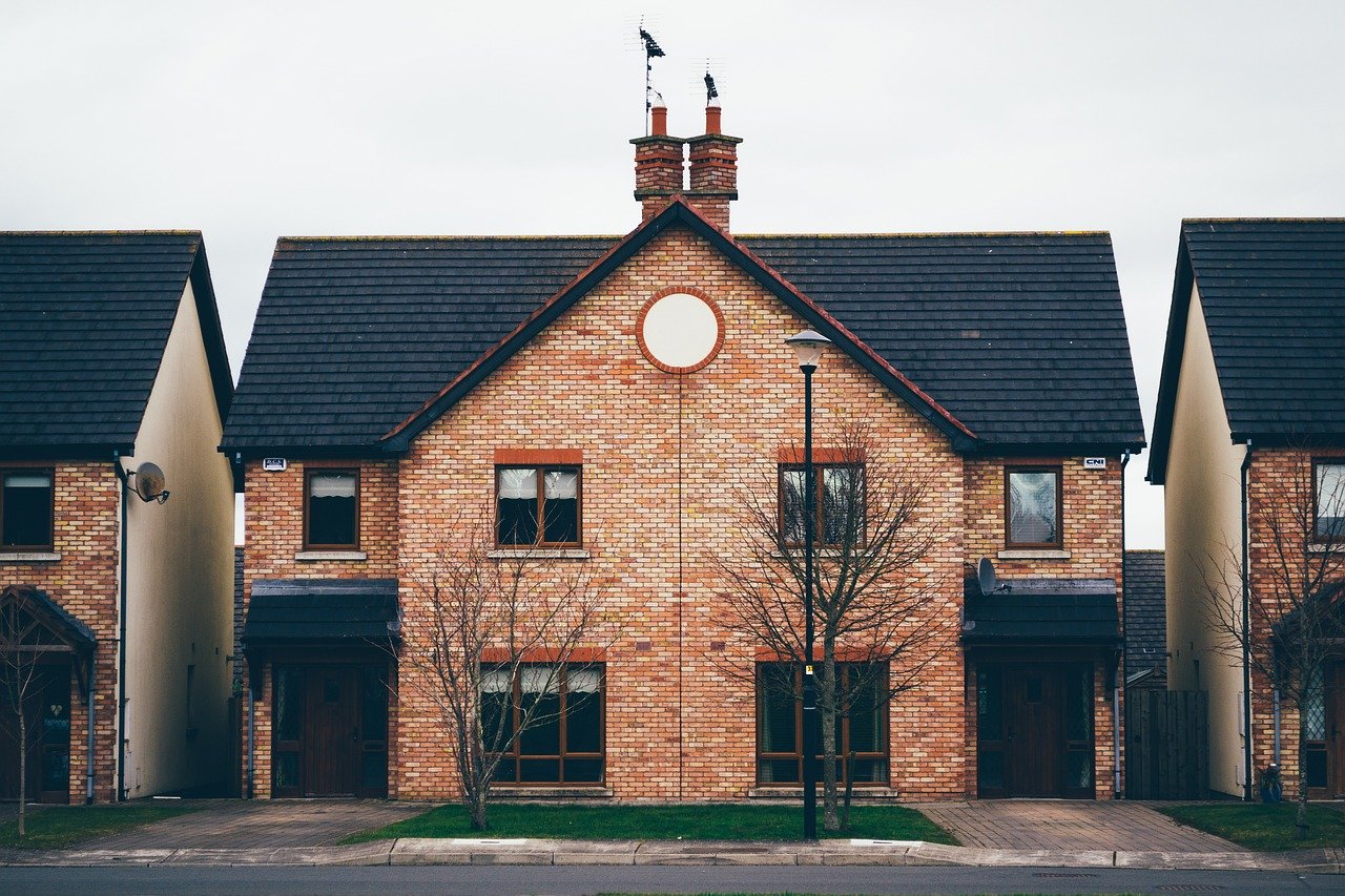 Detached house with black roof and brown facade, showing November 2019 GTA Housing Market Report.