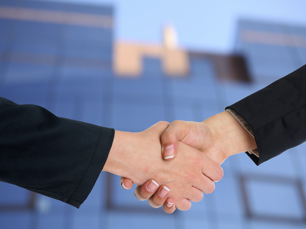 Handshake close up, showing deal between a real estate broker and client.