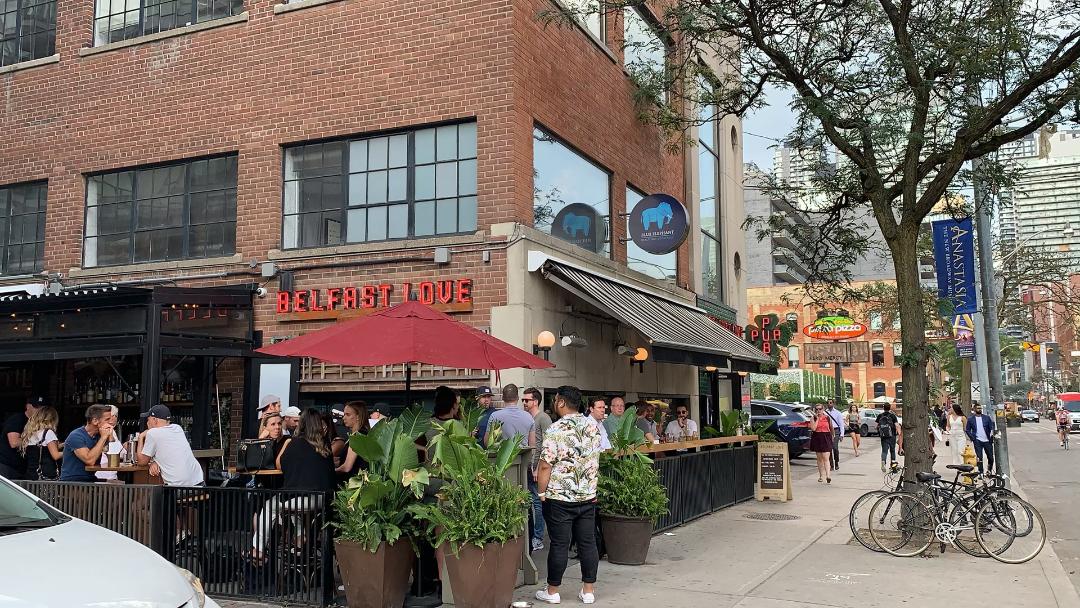 Belfast Bar with crowded patio. in Toronto's Entertainment District.